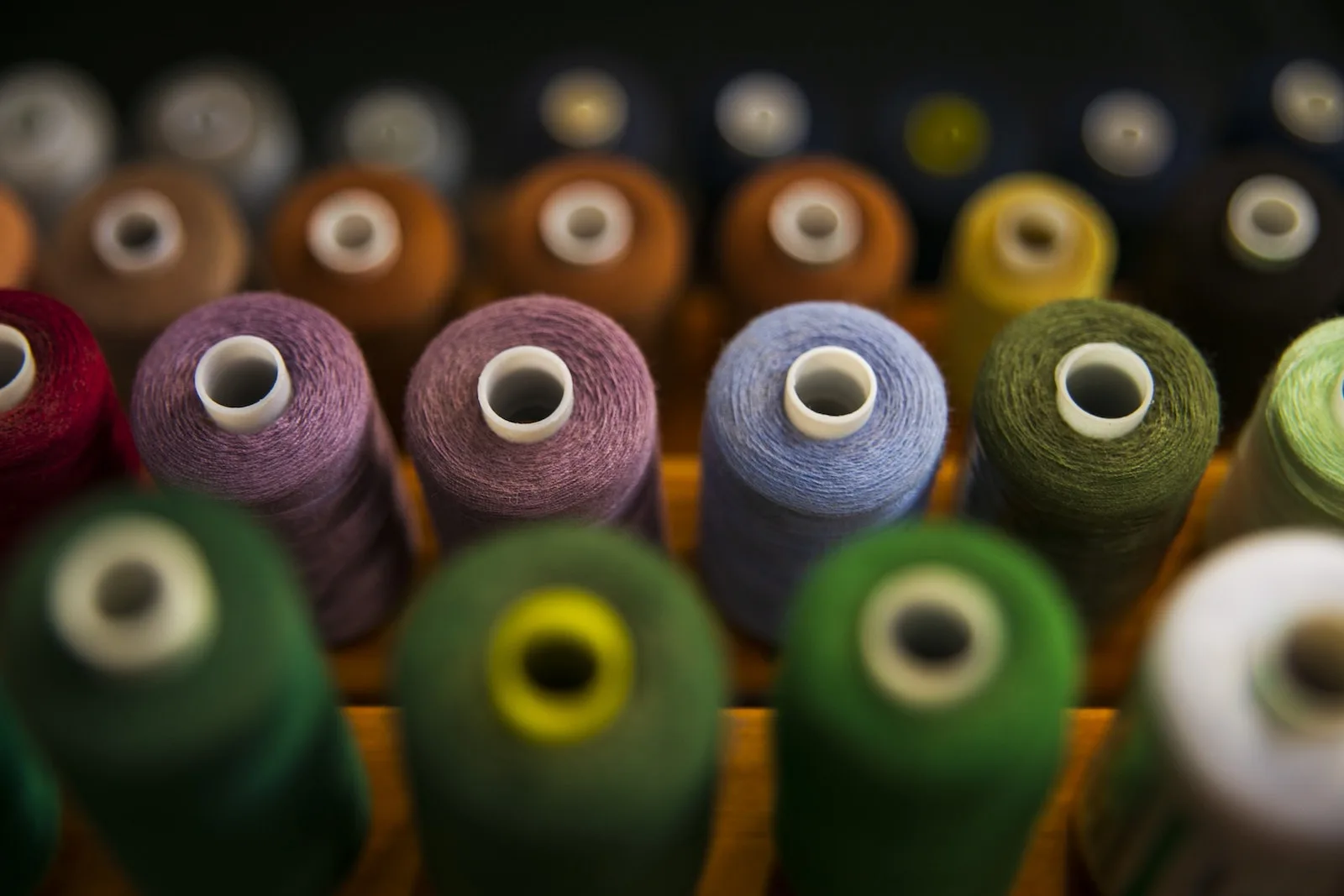 Selective Focus Photography Of Assorted Coloured Thread Spools